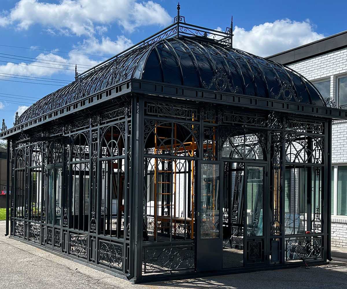 side view of black victorian greenhouse