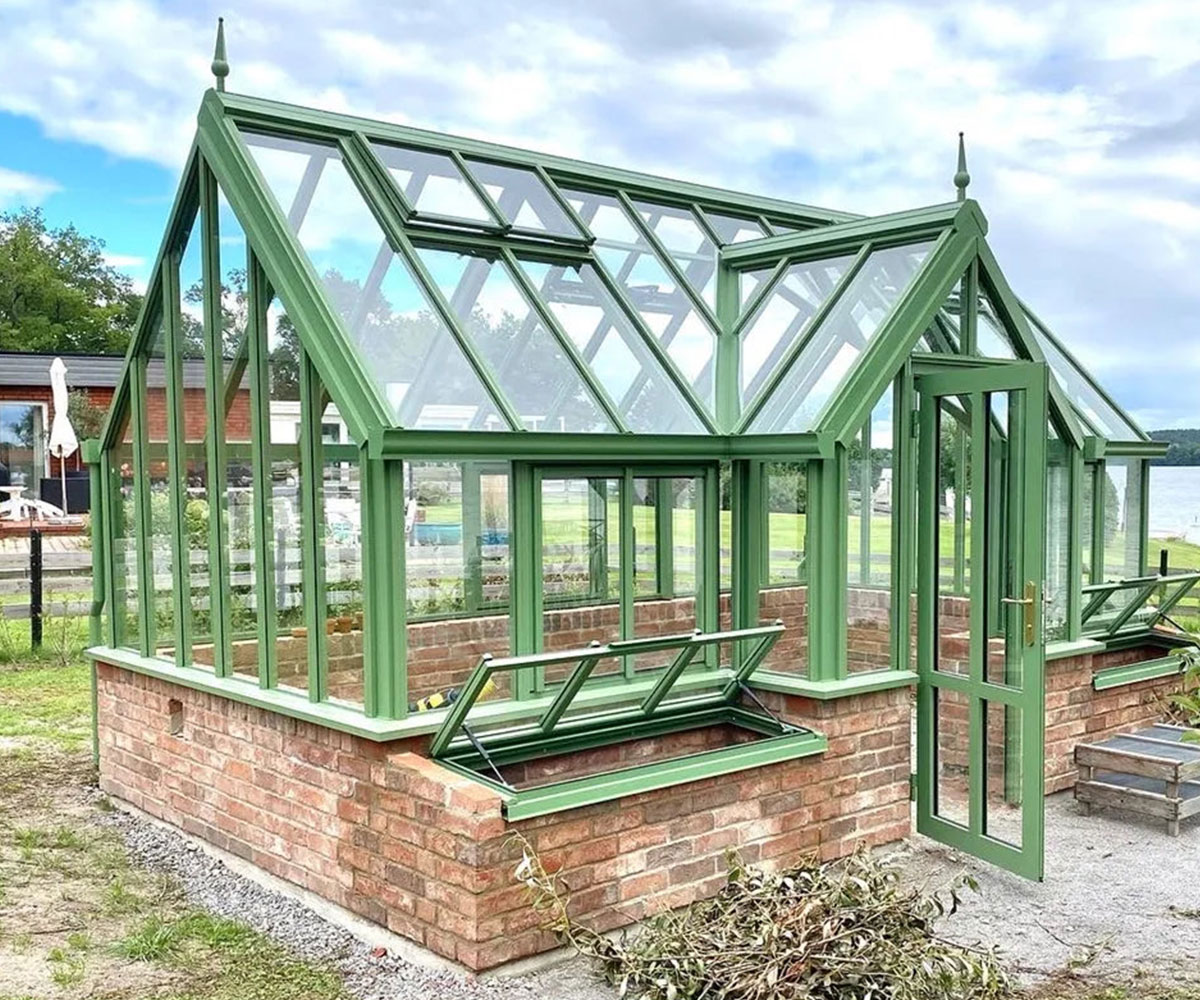 large iron victorian brick greenhouse