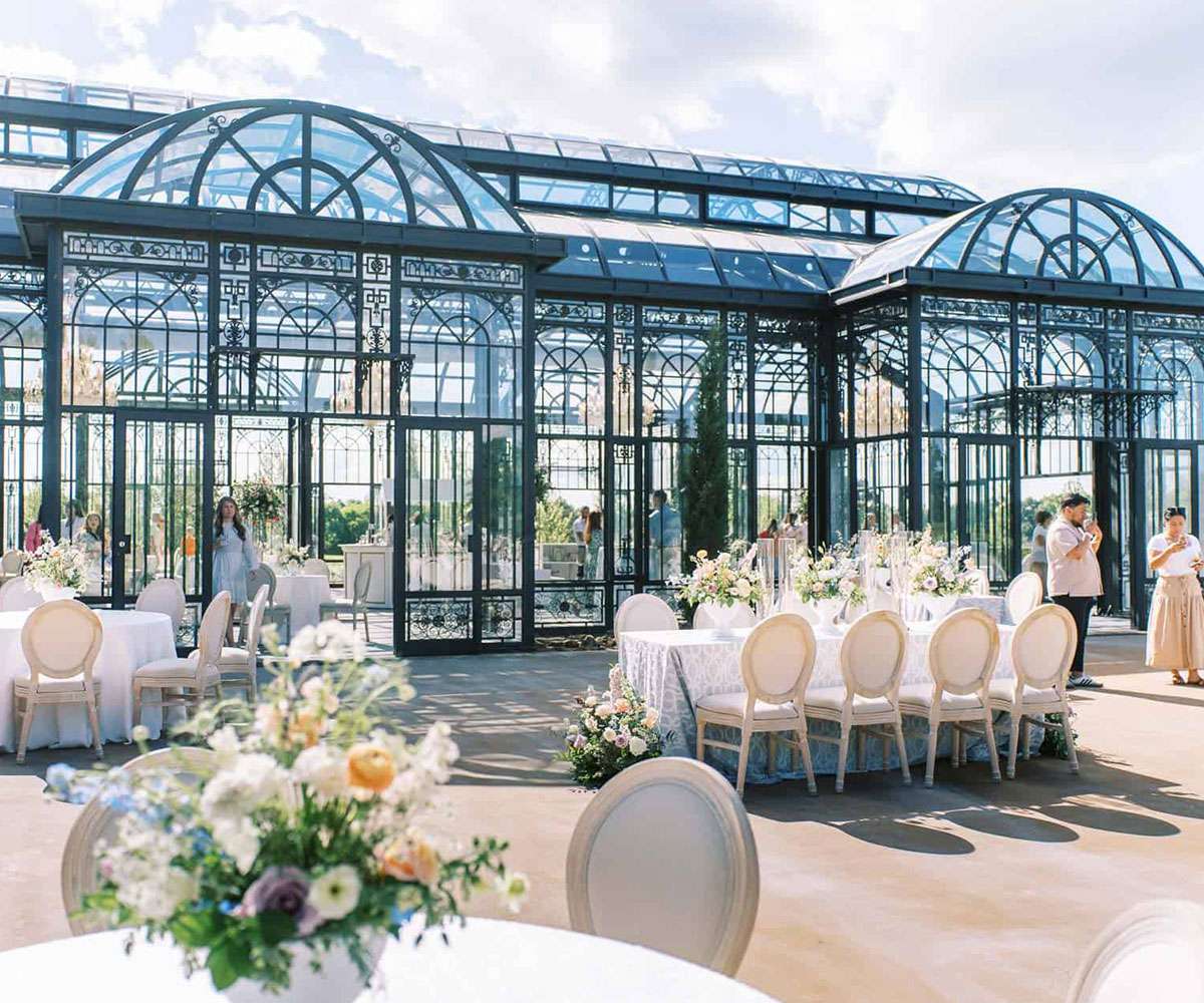 large outdoor iron greenhouse