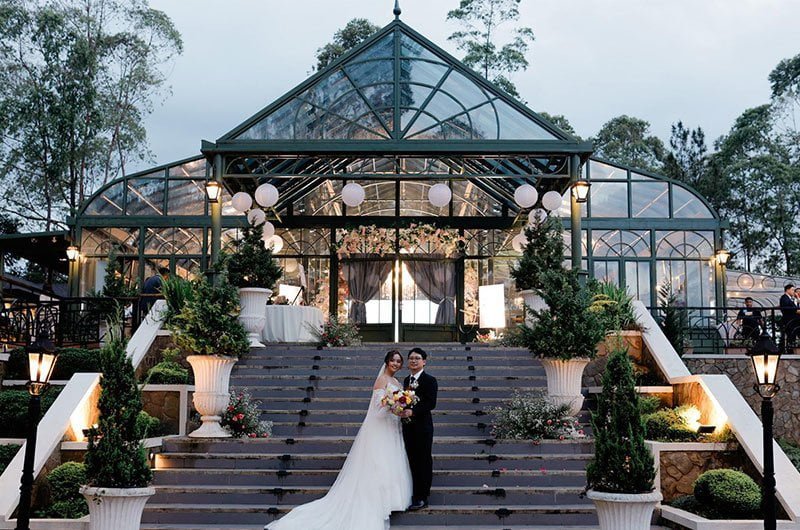 Night Wedding with Chandelier Lighting in Conservatory