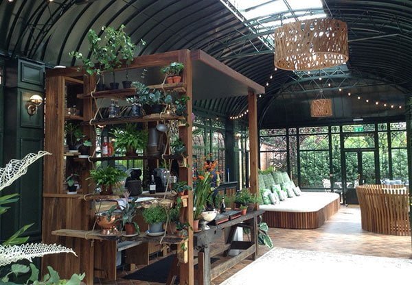 Yoga and exercise room inside a bright glass conservatory
