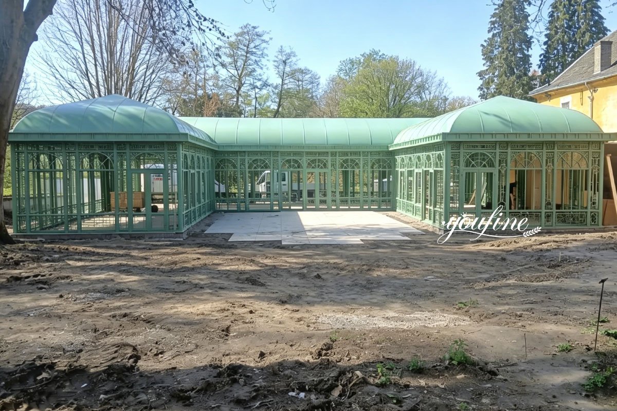 wrought iron greenhouse with porch